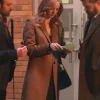 Model wearing karen page daredevil born again brown coat