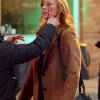 Karen page daredevil born again brown coat side view