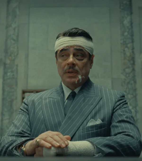 Model wearing benicio del toro the phoenician scheme grey blazer