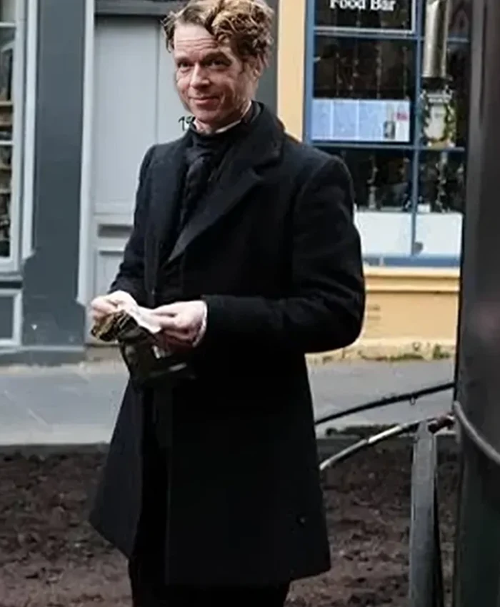 Frankenstein 2025 nikolaj lie kaas black coat side view
