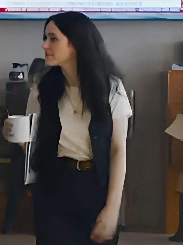 Model wearing superman rachel brosnahan black vest