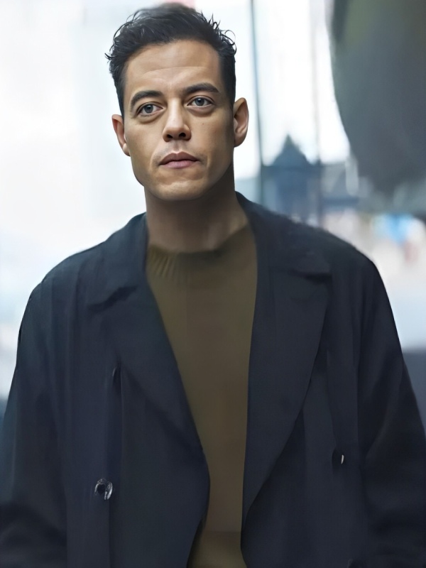 The amateur 2025 rami malek trench coat front view